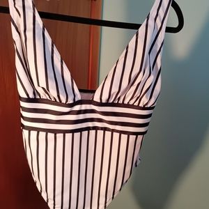 Women's one piece, black & white striped swimsuit.